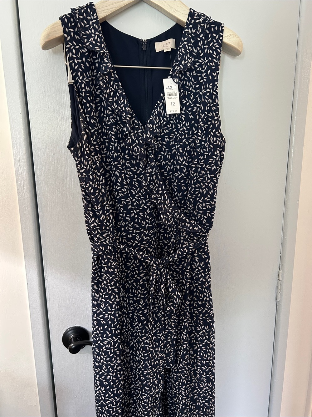 LOFT Navy & White Sleeveless ruffled v-neck, tie waist wide leg jumpsuit.